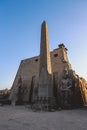 Sunset View to the Illuminated Stone Statues of the large Ancient Egyptian temple in Luxor Royalty Free Stock Photo