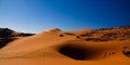 Sunset view to Tin Merzouga dune with car at Tassili nAjjer national park, Algeria