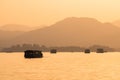 Sunset view of the West Lake in Hangzhou, China. Beautiful silhouette of chinese boats on the lake