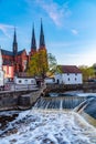 Sunset view of white building of Uppland museum and cathedral in Uppsala, Sweden