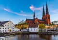 Sunset view of white building of Uppland museum and cathedral in Uppsala, Sweden Royalty Free Stock Photo