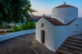 Sunset view of a white church at Greek town Lindos at Rhodes isl Royalty Free Stock Photo