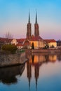 Ostrow Tumski and Cathedral of St. John the Baptist with water reflection, Wroclaw at sunset, Poland