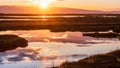 Sunset views of the tidal marshes of Alviso with colorful clouds reflected on the calm water surface, Don Edwards San Francisco Royalty Free Stock Photo