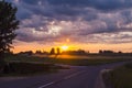 sunset in a village in Latvia road field clouds sun beautiful sunset 1