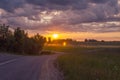 sunset in a village in Latvia road field clouds sun beautiful sunset 4