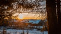 Sunset in the village winter in the forest landscape Royalty Free Stock Photo