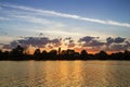 Sunset and water. Golden landscape. Sky, clouds, sun and sunset water with golden reflections.