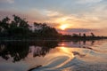 Sunset and water splash in billabong, Australia Royalty Free Stock Photo