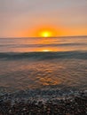 Sunset waves lake Superior stones rocks beach michigan Royalty Free Stock Photo