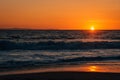 Sunset and waves in Pacific Ocean at Thousand Steps Beach, in Laguna Beach, Orange County, California Royalty Free Stock Photo