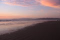 Sunset, waves and waders at Pismo Beach