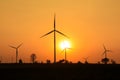 Sunset at wind turbine farm