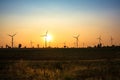 Sunset at wind turbine farm