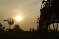 Sunset with windmill backlighting Royalty Free Stock Photo