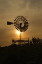 Sunset with windmill backlighting Royalty Free Stock Photo