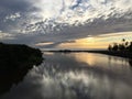 Sunset in Winter above Waimea River Entering Pacific Ocean on Kauai Island, Hawaii.