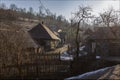 Sunset in the winter Carpathian mountains. Authentic wooden private building in the Carpathians. Picturesque sunset in the mountai