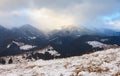Sunset in winter mountains with dramatic light Royalty Free Stock Photo