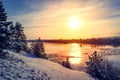 Sunset winter snow nature river horizon landscape. Winter snow forest river sunset view. Sunset winter river snow.