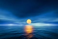 Sunset yellow sun calm blue sea with sun through nature horizon over the water with a cloudy sky Royalty Free Stock Photo