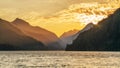 Sunsetting behind the mountains of Muchalat lake Royalty Free Stock Photo