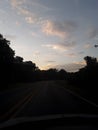 Sunsetting sky while driving Royalty Free Stock Photo