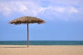 Sunshade on beach with blue sky and white cloud Royalty Free Stock Photo