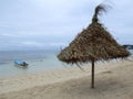 Sunshade on a beach in cloudy weather Royalty Free Stock Photo