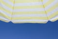 Sunshade on blue sky background