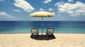 Sunshade between two empty loungers on a sandy beach in front of a tranquil blue sea