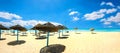 Sunshades on the sandy beach at sunny day. Nabeul, Tunisia, North Africa Royalty Free Stock Photo