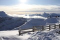 Sunshine and clouds on the Tetes Des Saix 2118m ski run above Samoens in the French Alps