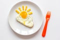 Sunshine fried eggs breakfast for kid on white background Royalty Free Stock Photo