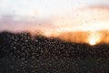 Sunset behind windowglass with raindrops Royalty Free Stock Photo
