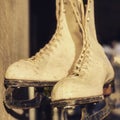 A pair of old ice skates hang outside of a cafe in Ukraine