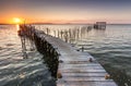 Sunshine from a sunset on a old pier