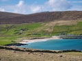 With sunshine on turquoise water, the pristine, deserted Norwick beach on the island of Unst, Shetland, UK Royalty Free Stock Photo