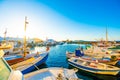 Sunshine view of turquoise bay with colorful yachts of greek island Paros