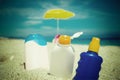 Suntan lotions on the sand Royalty Free Stock Photo