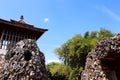 Sunyaragi Cave Taman Wisata Gua Sunyaragi, Cirebon, Indonesia antique coral reef rocks stacked with blue sky wooden house on top Royalty Free Stock Photo