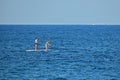 A SUP Race Paddling A Surf Board standing Up In Gran Alacant