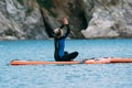 SUP Stand Up Paddle Board Yoga on the sea Royalty Free Stock Photo