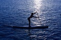 SUP Stand up Surf girl with paddle Royalty Free Stock Photo
