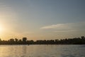 SUP Surfers At Sunrise on lake near city