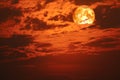 super blood snow moon back on silhouette cloud on sunset sky Royalty Free Stock Photo