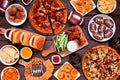 Super Bowl or football theme food table scene, overhead view on dark wood Royalty Free Stock Photo