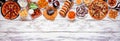Super Bowl or football theme food top border on a white wood banner background Royalty Free Stock Photo