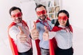 super businesspeople in masks and capes showing thumbs up Royalty Free Stock Photo