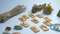 Super closeup. magic background, runes, dried herbs and stones on the table